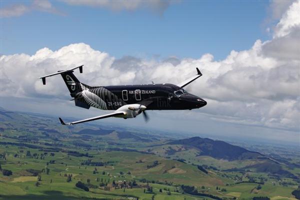 Air NZ Beech 1900 black - in air.